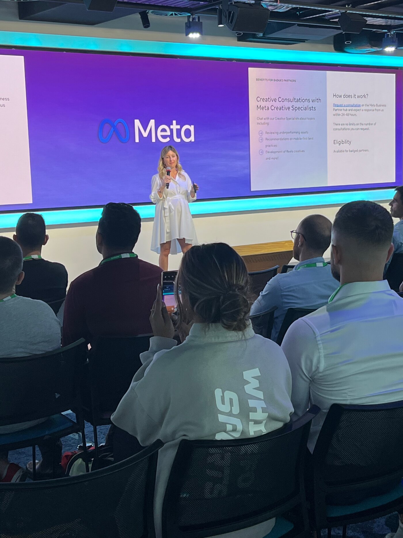 Celeste presenting on stage at a Meta event, with the Meta logo displayed behind her